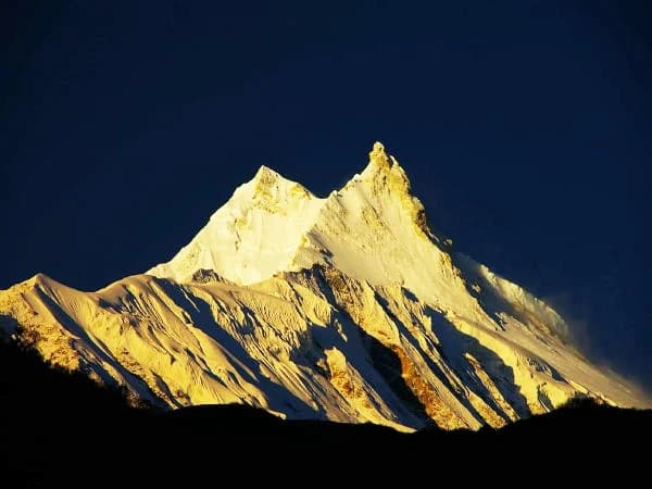 Golden peak of Mount Manaslu during sunset for Manaslu Circuit Trek permit guide - Thrill Himalaya Treks